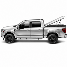 Load image into Gallery viewer, UnderCover Elite LX bed cover installed on 2024-2026 Ford F-150 with 5.7ft bed and Carbonized Gray color match