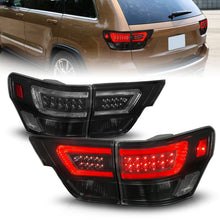Load image into Gallery viewer, ANZO NOVA LED taillights black smoke installed on 2011-2013 Jeep Grand Cherokee