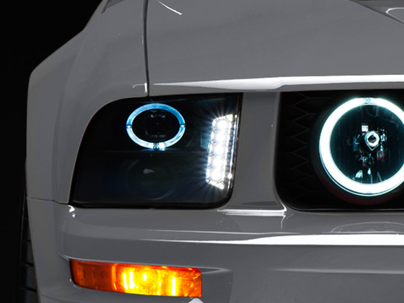 Raxiom 05-09 Ford Mustang w/ Halogen LED Halo Prjctr Headlights-Blk Hsng(Smoked Lens Exclude GT500)-Headlights-Raxiom