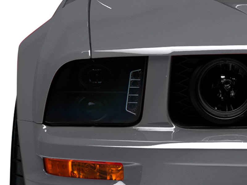 Raxiom 05-09 Ford Mustang w/ Halogen LED Halo Prjctr Headlights-Blk Hsng(Smoked Lens Exclude GT500)-Headlights-Raxiom