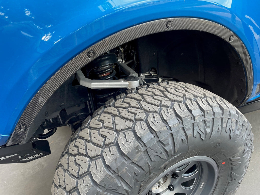 Set of four Anderson Composites Carbon Fiber Fender Flare Delete panels displayed before installation