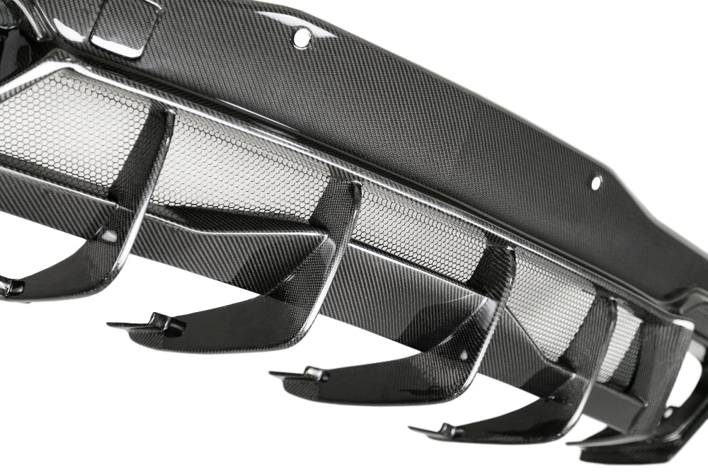 Top-down shot displaying diffuser curvature and polished carbon fiber texture.