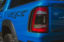 Load image into Gallery viewer, Anderson Composites 21-23 Dodge RAM TRX Taillight Surround SKU: AC-TLS21DGTRX