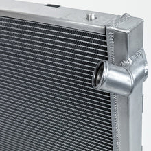 Load image into Gallery viewer, Close-up of CSF 7242 polished aluminum radiator end tank and side construction
