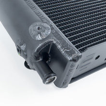 Load image into Gallery viewer, Close-up of CSF heat exchanger end tank and aluminum construction for McLaren models