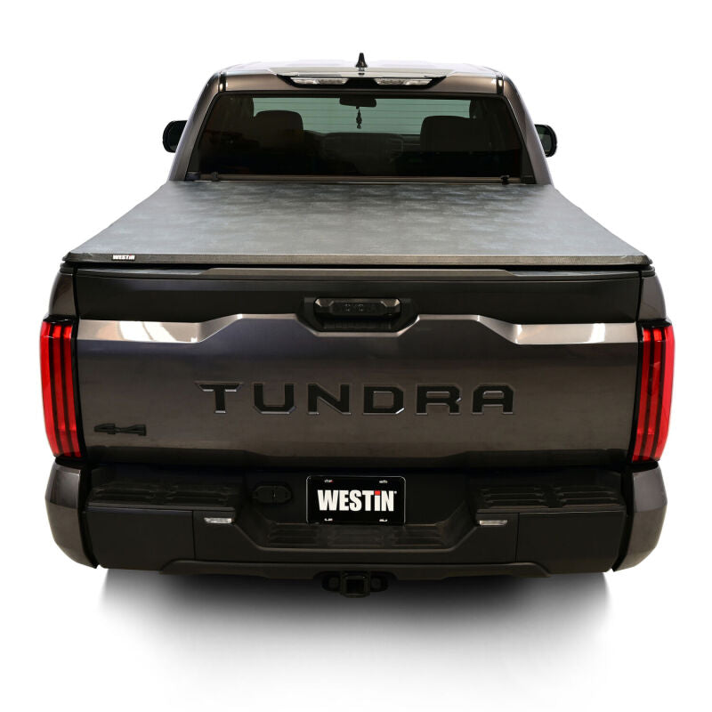 Westin 19-20285 tonneau cover clamp secured beneath the Toyota Tundra bed rail.