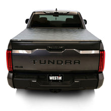 Load image into Gallery viewer, Westin 19-20285 tonneau cover clamp secured beneath the Toyota Tundra bed rail.