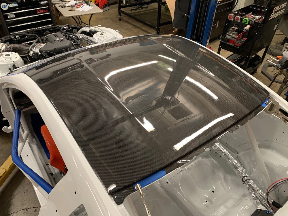 Front angle of Anderson Composites 2015–2024 Ford Mustang dry carbon roof replacement