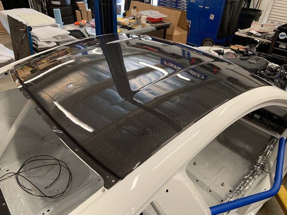 Front angle of Anderson Composites 2015–2024 Ford Mustang dry carbon roof replacement