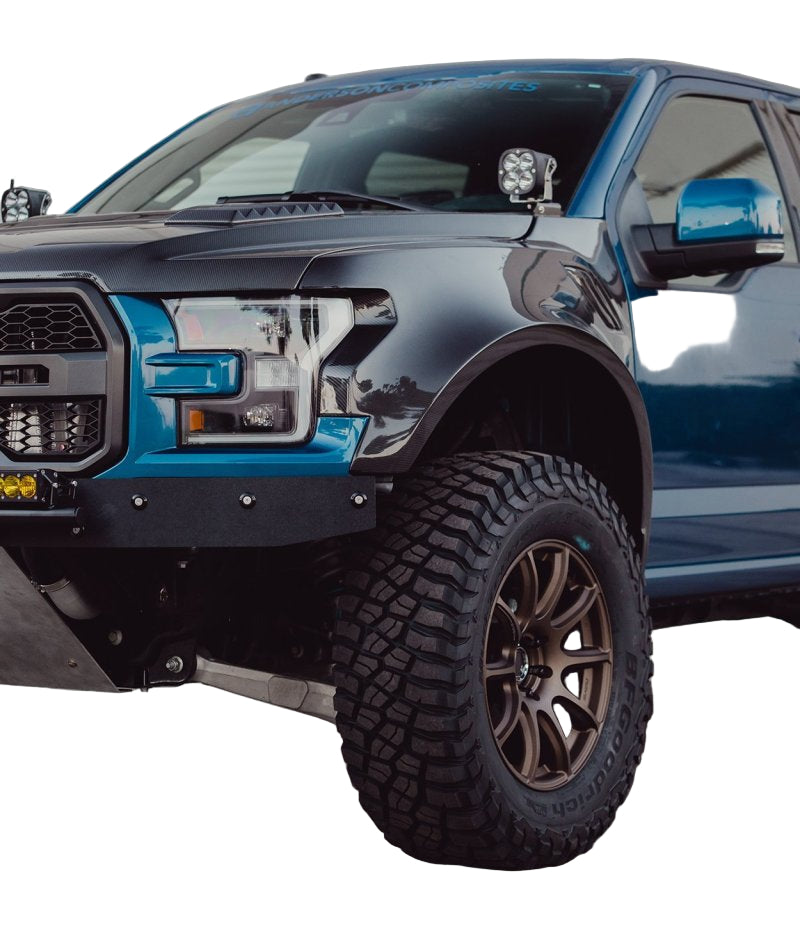 Installed fenders on Ford Raptor showcasing aggressive stance.