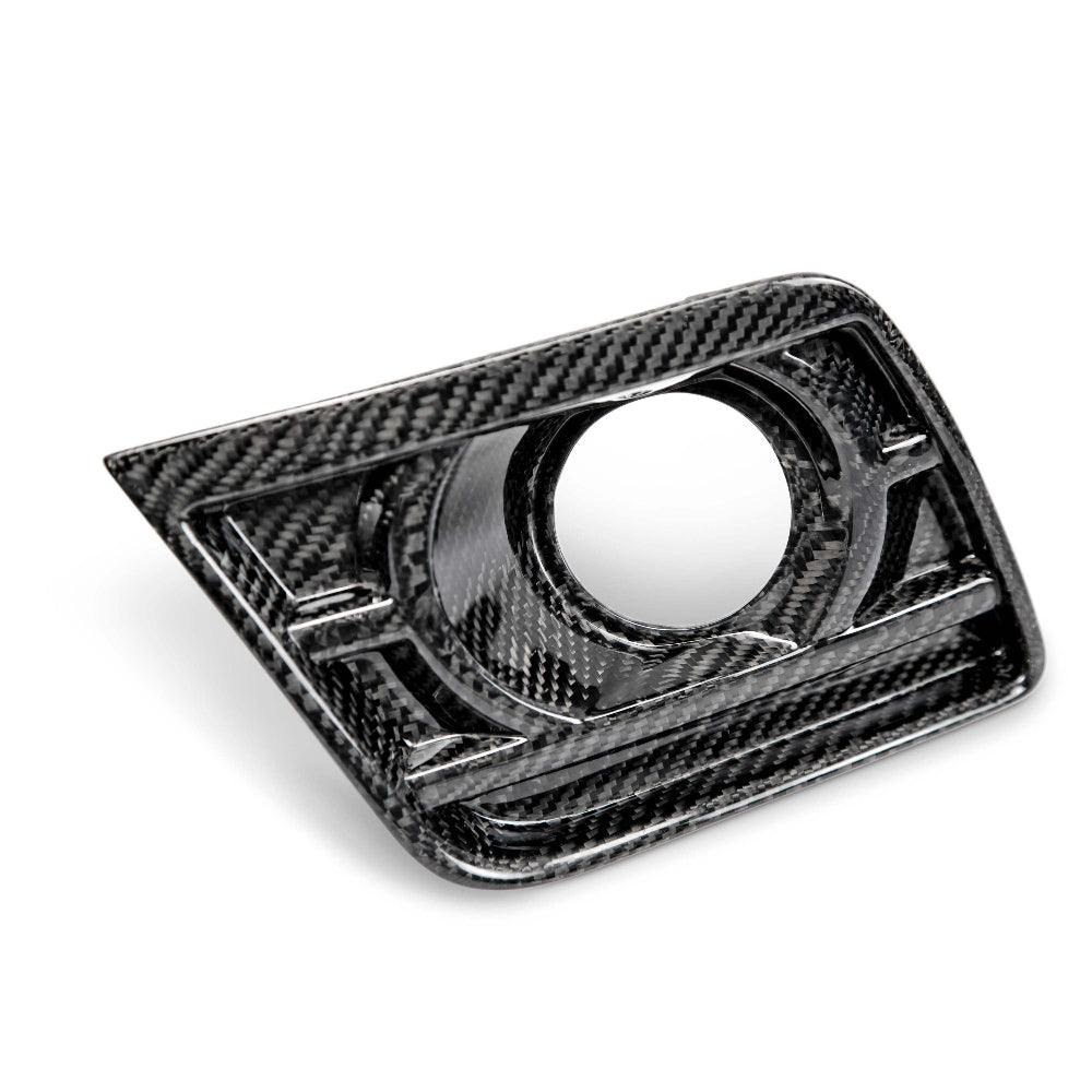 Angled side view of carbon fiber fog light bezel pair
