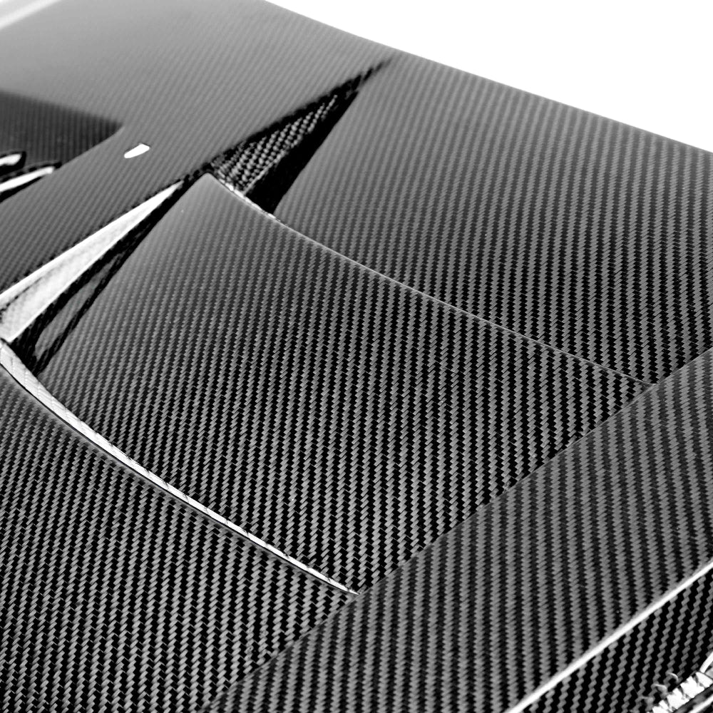 Side profile highlighting hood curvature and fitment