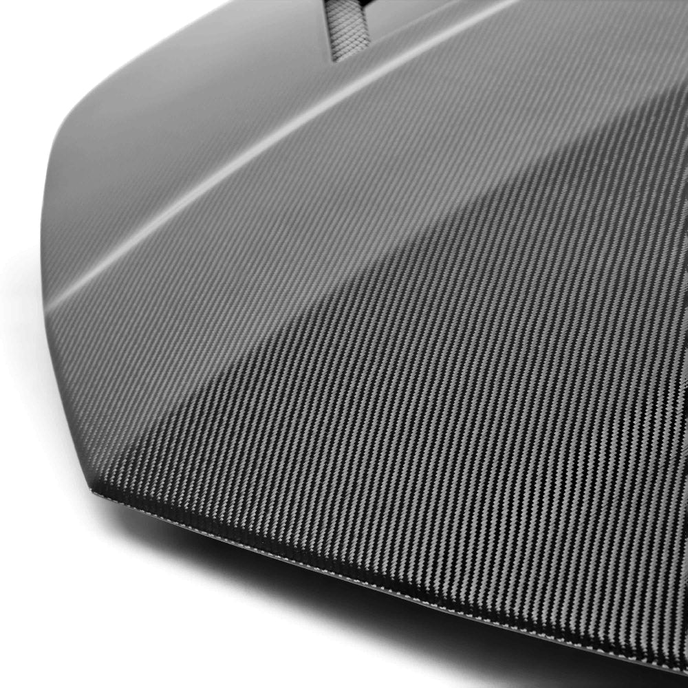 Close-up of vent structure and carbon fiber twill weave texture.