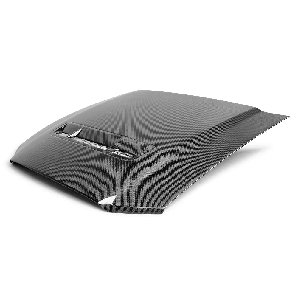 Top-down shot showing GT-style vent layout and polished carbon fiber finish
