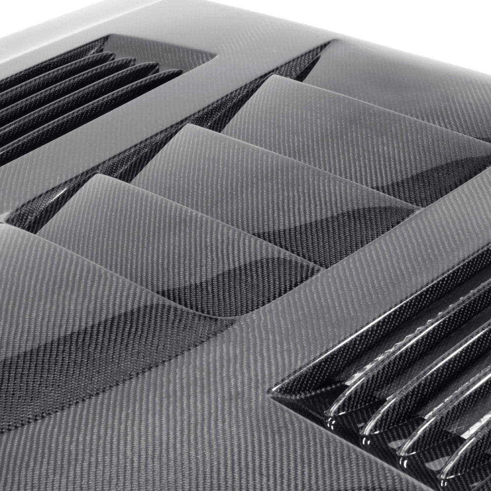 Top view showing heat extractor vents and high-gloss carbon fiber finish