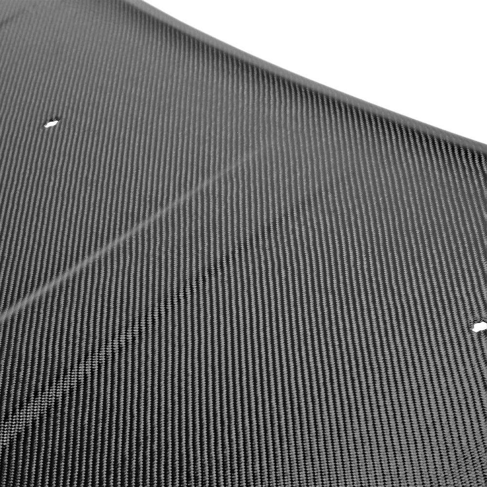 Top view showing OEM-style smooth surface and carbon fiber weave