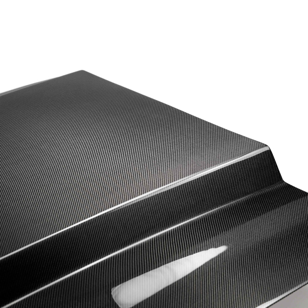 Close-up detail of 2x2 twill carbon fiber texture and gloss finish