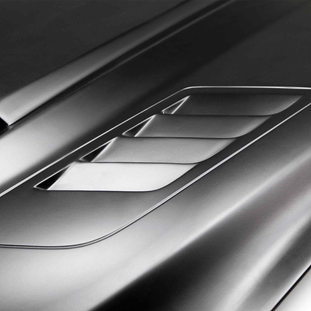 Underside of Anderson Composites Ram Air Fiberglass Hood showing reinforced inner structure and OEM-style mounting points.