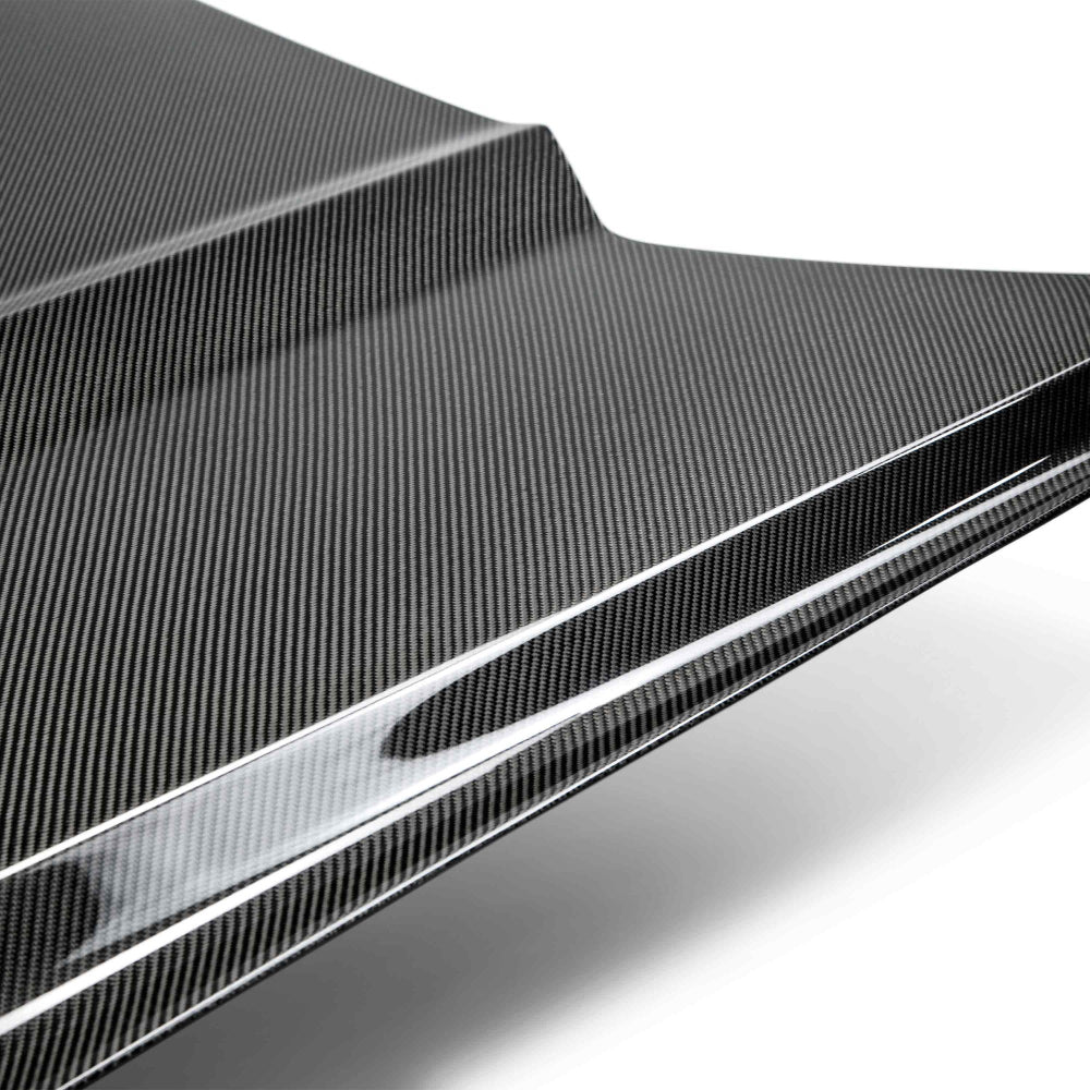 Side profile of the 2015–2017 Mustang Type-OE hood displaying OEM-style fitment and glossy double-sided carbon fiber surface.