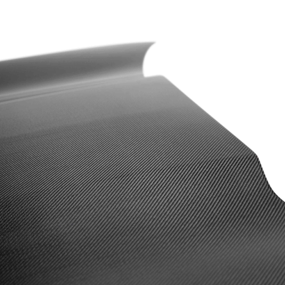 Close-up of 2x2 twill carbon fiber pattern with polished UV-resistant finish.