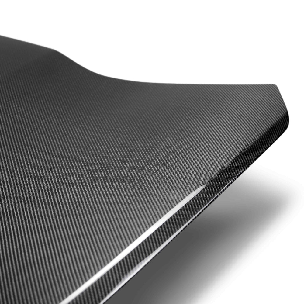 Close-up of 2x2 twill carbon fiber pattern with polished UV-resistant finish.