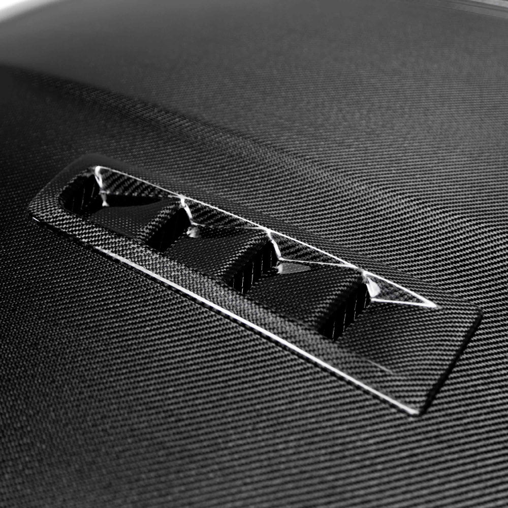 Underside view showing carbon structure and OE-style mounting points.