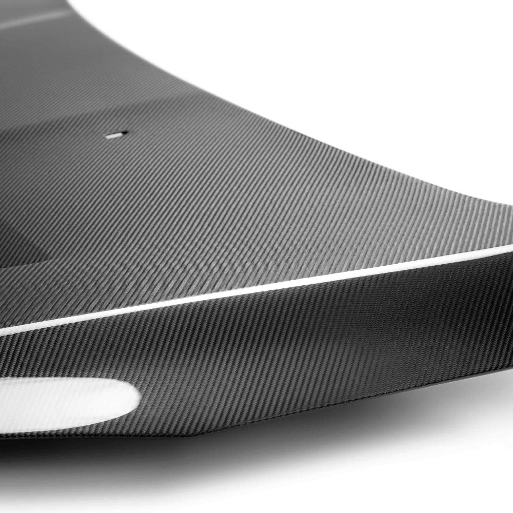 Close-up of the carbon fiber texture and removable mesh vents.