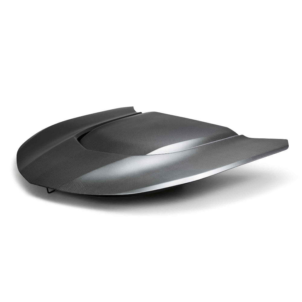 Top-down angle showing matte dry carbon weave and OE-style contours.