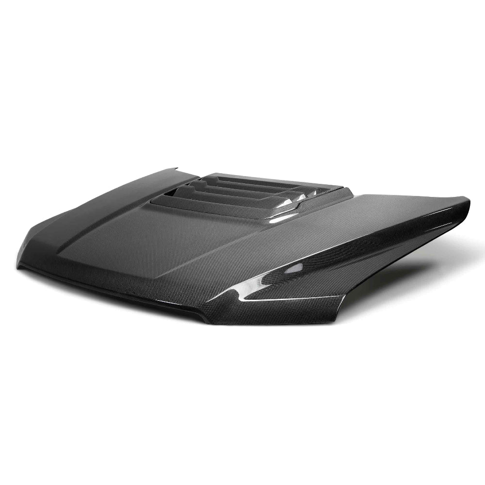Top-down view showing hood vent detail and carbon weave finish.