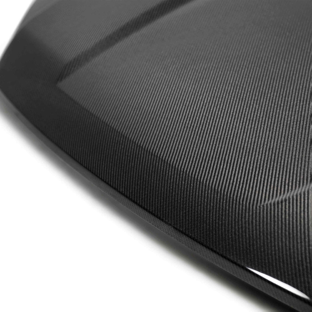 Side profile highlighting OEM-style contours and glossy carbon texture.