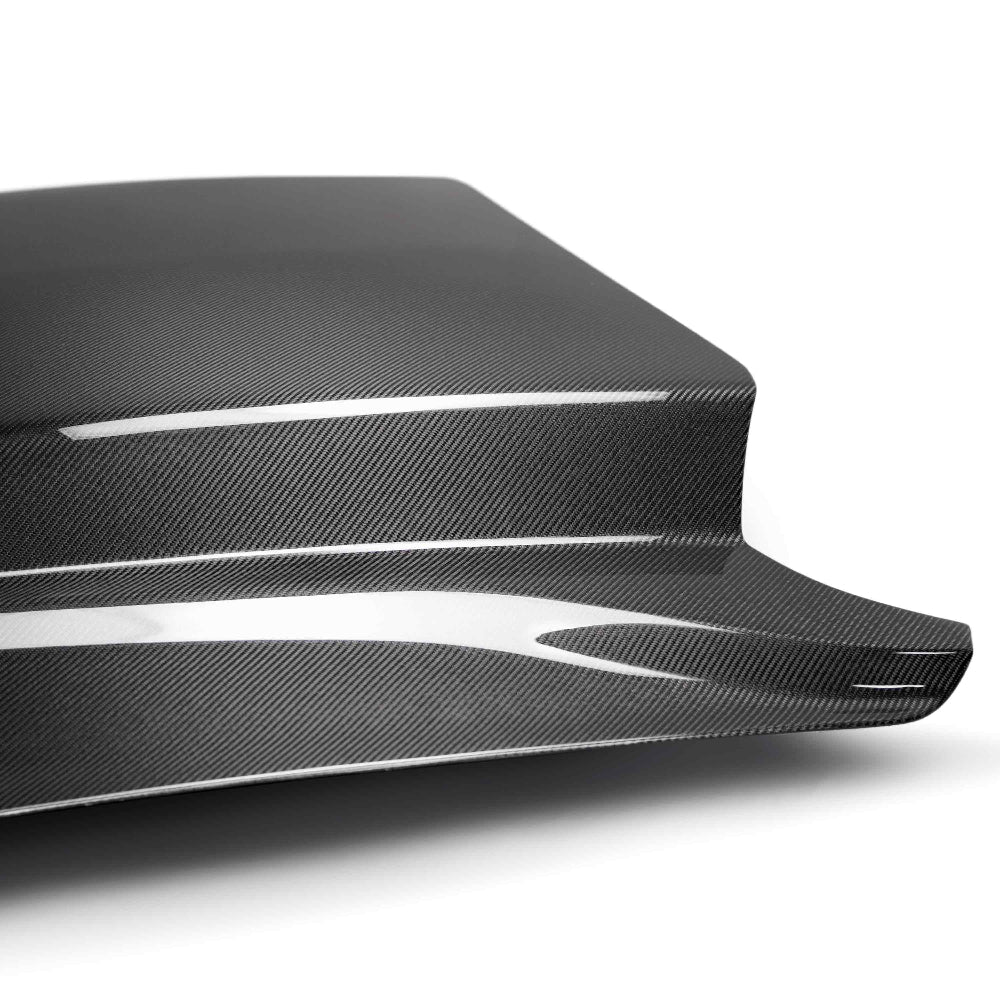 Rear angle showing cowl rise and seamless body integration.