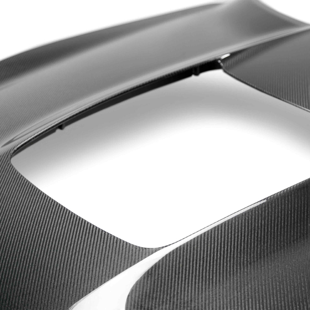 Close-up of carbon fiber twill pattern and polished gloss finish