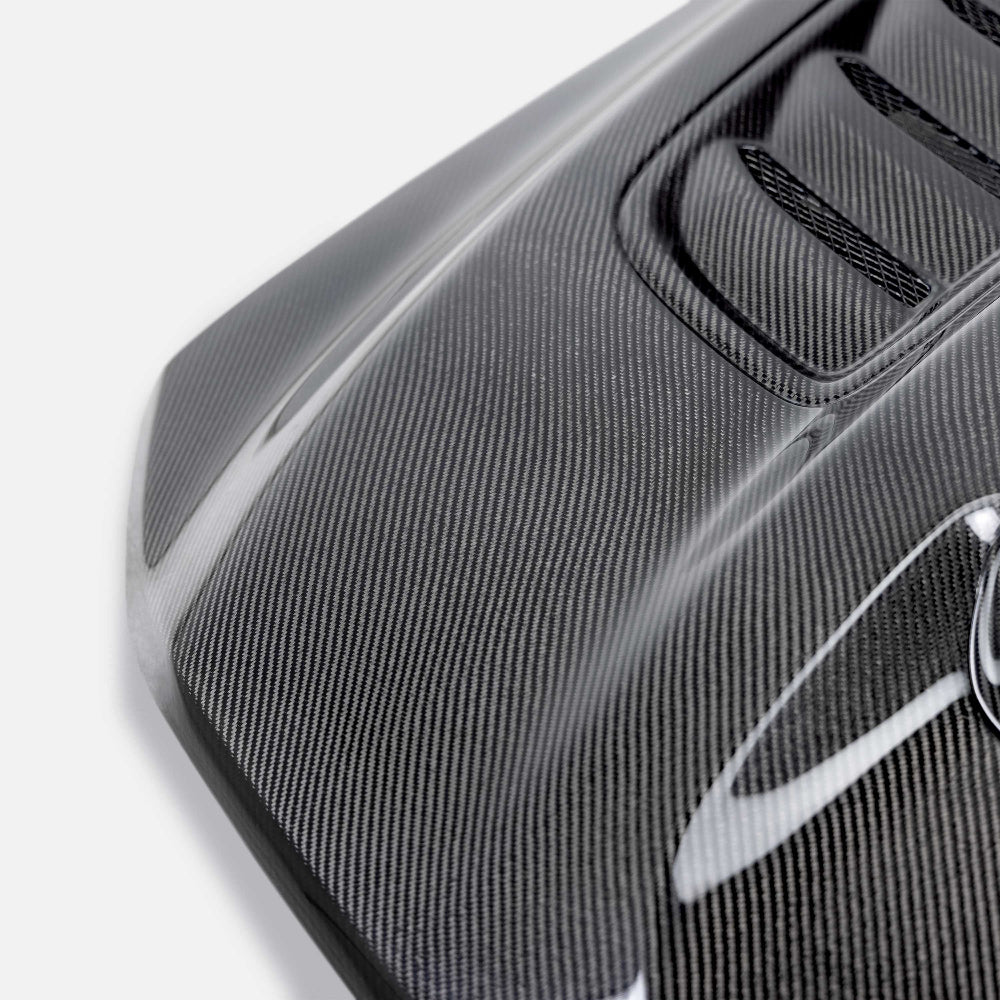 Close-Up of TRX Carbon Fiber Hood Vents and Amber Lamp Housing