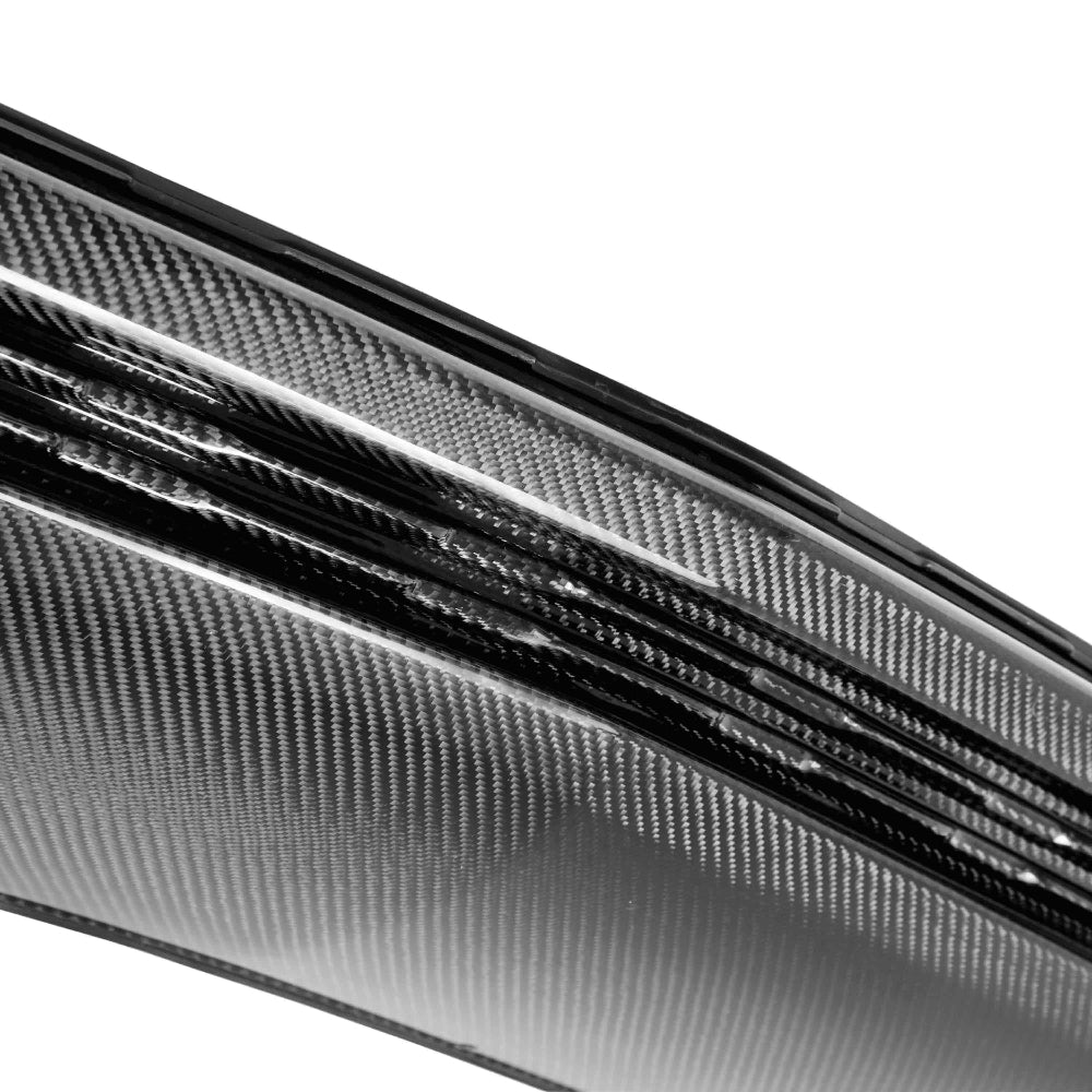 Close-up of carbon fiber weave and surface gloss detail