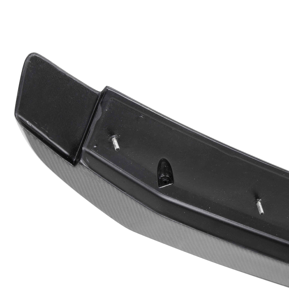 Front-facing angle showing carbon texture and OEM styling