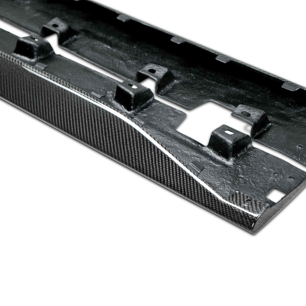Pair of Type-OE carbon fiber rocker splitters laid flat to display curvature and precision-fit edges.