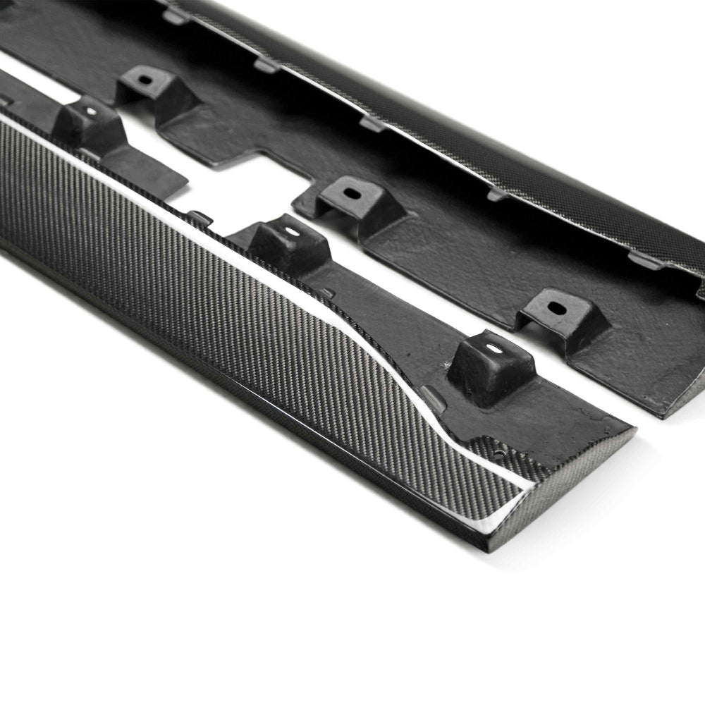 Pair of 2015–2023 Mustang Type-AR carbon fiber rocker splitters displayed flat to show contour and fitment precision.