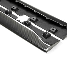 Load image into Gallery viewer, Pair of 2015–2023 Mustang Type-AR carbon fiber rocker splitters displayed flat to show contour and fitment precision.