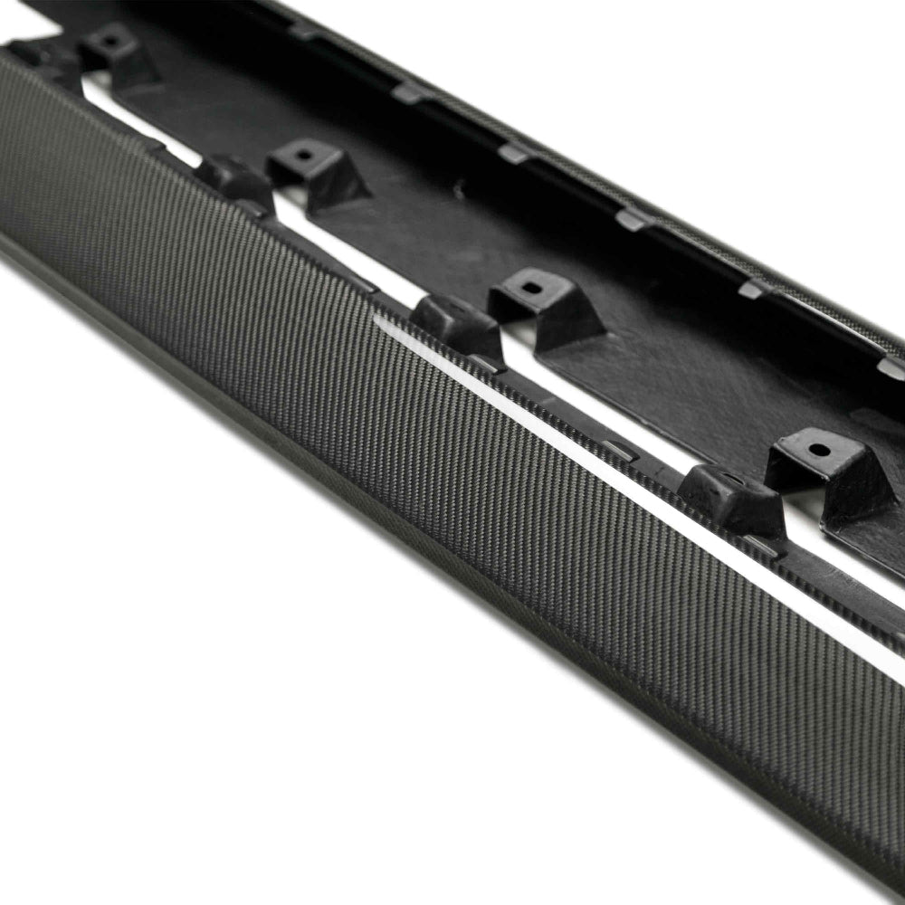 Installed Anderson Composites Type-AR rocker splitters on Ford Mustang — aggressive side styling and gloss carbon finish.