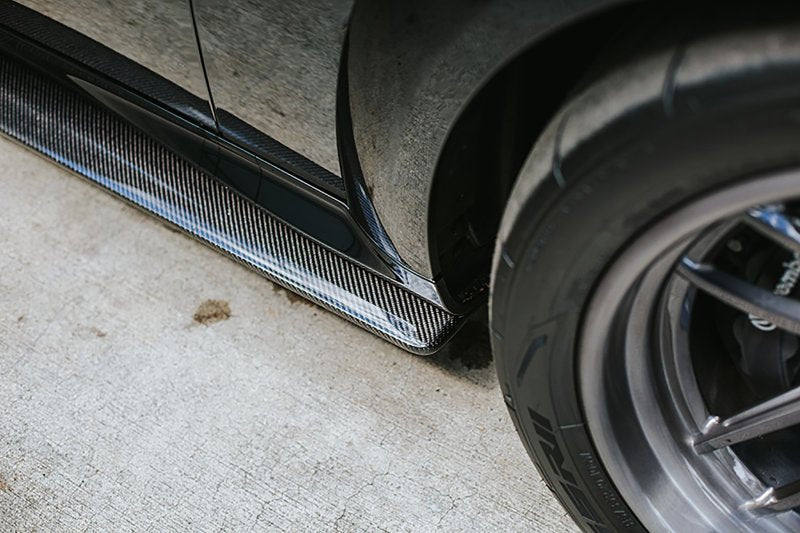 Rear-quarter shot showing aerodynamic profile and flush alignment with factory rocker.