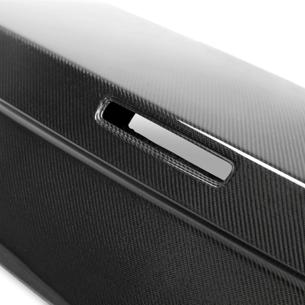 Close-up showcasing weave pattern and UV-protected clear coat of the carbon decklid.