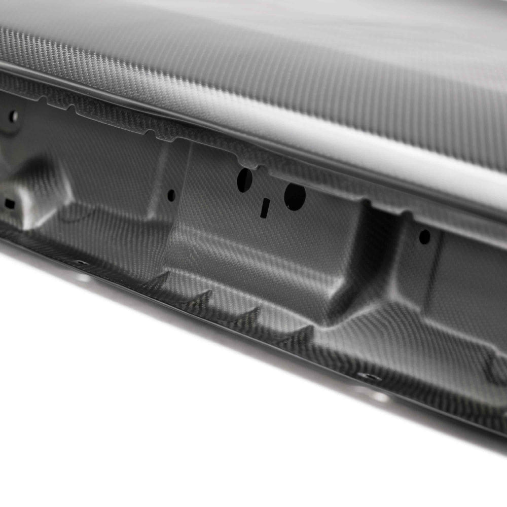 Detail view of the Anderson Composites Challenger Dry Carbon Decklid weave uniformity and finish.