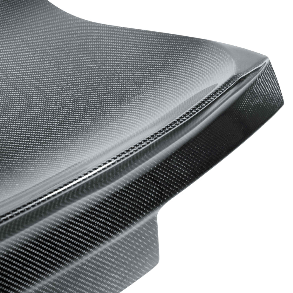 Close-up of the carbon fiber weave detailing and polished gloss finish.