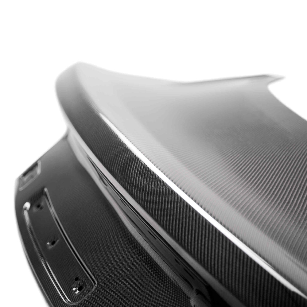 Close-up of 3K 2x2 twill carbon fiber weave detail with a deep gloss UV-protected finish.