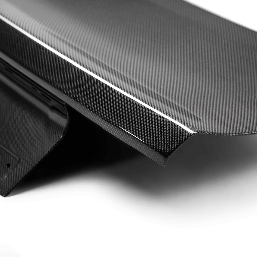 Underside of decklid showing fully bonded carbon fiber skeleton structure for rigidity and lightweight strength.