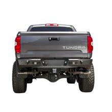 Load image into Gallery viewer, Addictive Desert Designs 2014+ Toyota Tundra Stealth Fighter Rear Bumper w/ Backup Sensor Cutouts - Black Ops Auto Works
