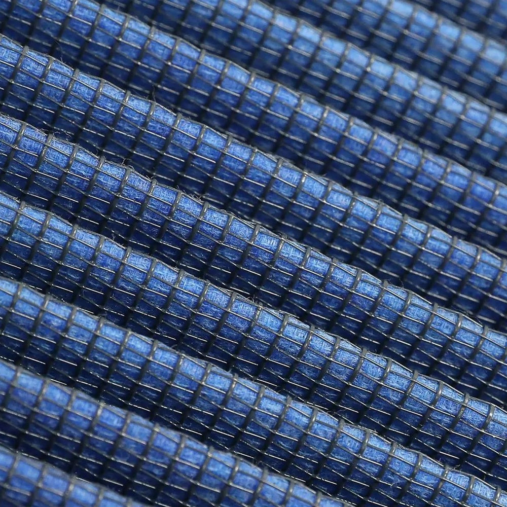 Macro close up of the aFe Pro 5R five layer oiled cotton gauze filter media pleats used in the 20-91211R air filter