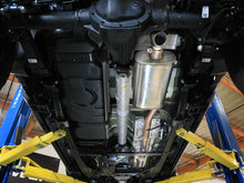 Load image into Gallery viewer, aFe Rock Basher exhaust system installed underneath a truck on a lift, full underbody view