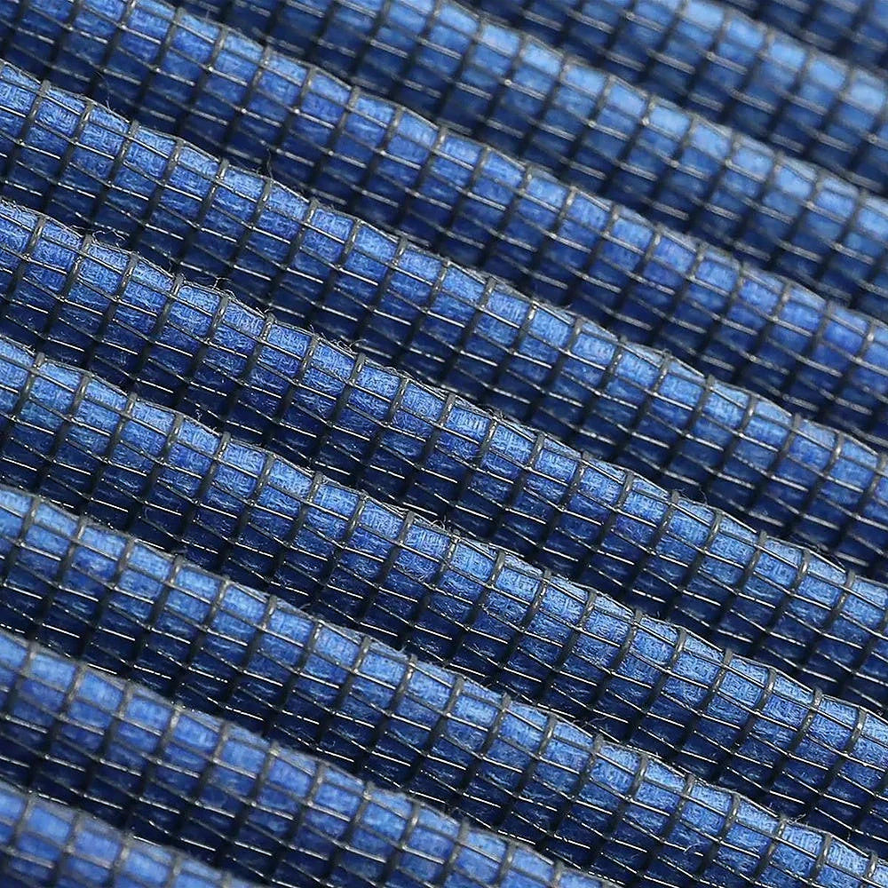 Macro close up of the aFe Pro 5R five layer oiled cotton gauze filter media pleats used in the 20-91211R air filter