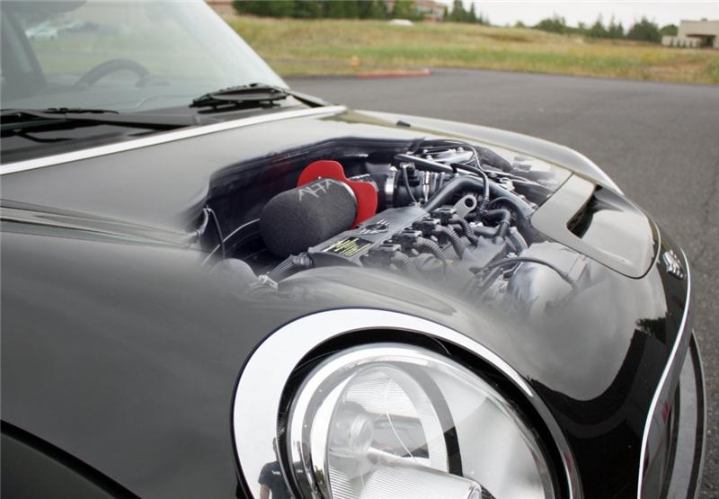 Close-up of red aluminum air box and high-flow foam filter